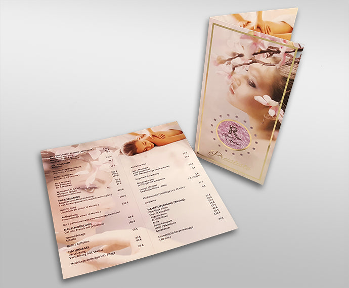 Zwei Klappflyer mit Goldfolierung